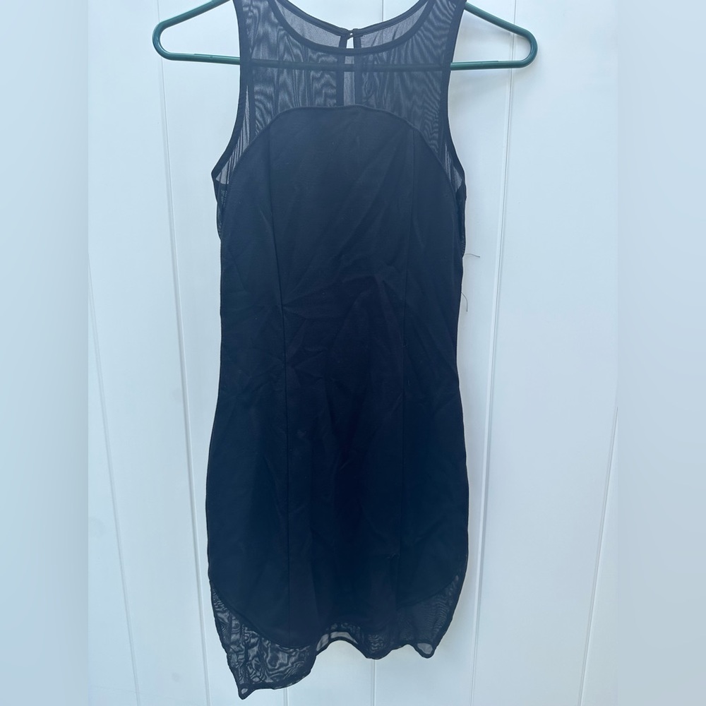 Express black mini dress with sheer detailing. Size 0